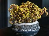 a vase with a bunch of flowers in it on a table
