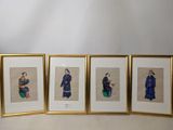 three framed pictures of asian women sitting on a table