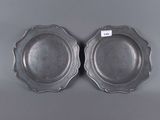 a pair of silverplated dishes with scalloped rims