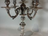 a silver candelier that is on a table