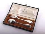 a silverware set in a case with a fork and spoon