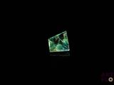 an image of a green diamond in the dark with a black background