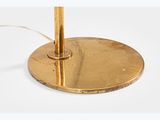 a close up of a brass plate on a white surface