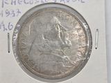 a picture of a silver coin on a piece of paper