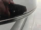 a person taking a picture of themselves in a car mirror
