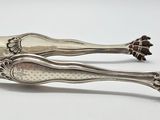 pair of silverware spoons on white surface with white background