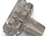 a silver object that is on a white surface