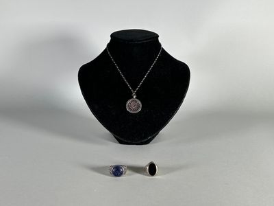 necklace and earring set on a mannequin stand
