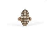 a close up of a diamond ring on a white background