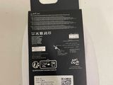 the back of a pair of white socks with a black label on it