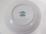 a white plate with a green and white design on it
