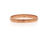 a close up of a gold ring on a white background