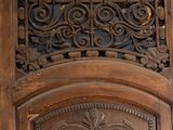 an old wooden door with a decorative design on it