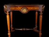 an antique wooden table with a clock on top of it
