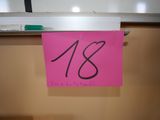 a pink sticky note with the number 18 on it