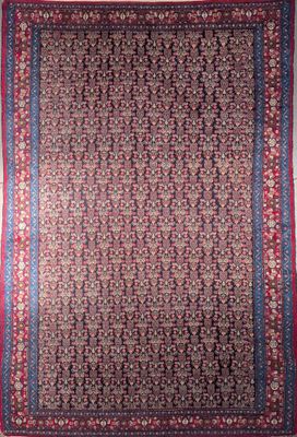 an antique persian rug with a red and blue border