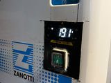 a machine that has a clock on the side of it
