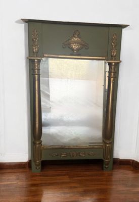 a mirror on the floor in the corner of a room