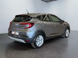 the rear end of a grey car in a showroom
