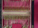 a case with a bunch of silverware in it