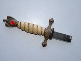 a picture of a knife with a red heart on it