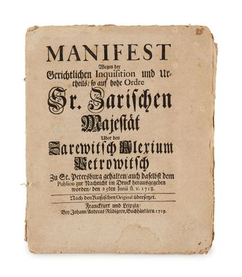 an old book with writing on it sitting on a white surface