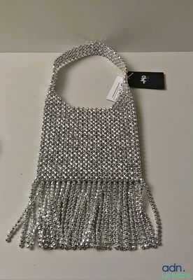 a close up of a purse with a tag on it