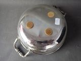 a silver plate with four cookies on it on a table