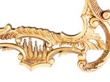a gold frame with a picture of a bird on it