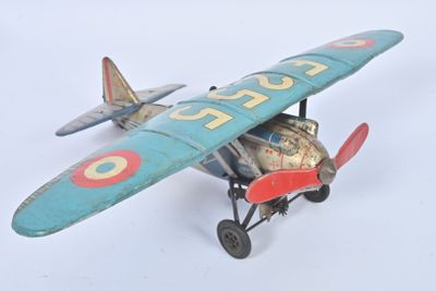 a toy airplane that is sitting on a white surface
