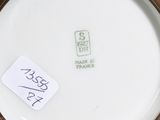 a person holding a bowl that has a tag on it