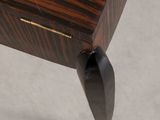 the table is made of wood and has black legs