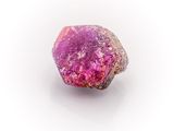 purple and pink rock on a white surface with a white background