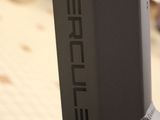 a close up of a metal pole with a cable attached to it