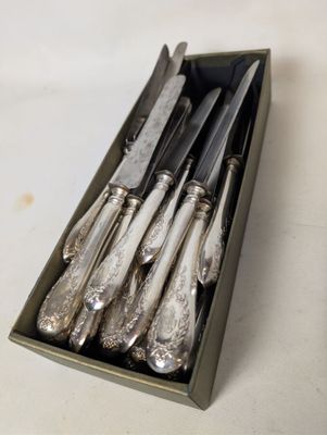 a box of silverware that is sitting on a table