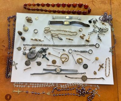 many different types of jewelry displayed on a table