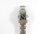 a silver wrist watch with a black face on a white background