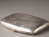 a small silver case sitting on top of a table