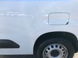 a white van that is parked on the side of the road