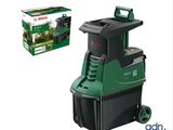 the bosch vacuum cleaner is next to a box of grass