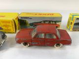 three toy cars are sitting next to each other on a table