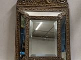 an antique mirror with a gold frame on a white background