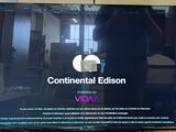 a flat screen tv sitting on a stand in a room