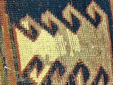 a close up of a rug with a cat on it