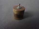 a close up of a small metal object on a table