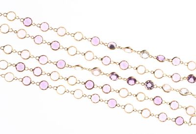 COLLIER en or jaune 750 °/°° ornée de topazes blanches, quar…