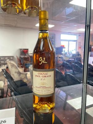 a bottle of wine that is on display in a glass case