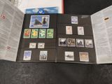 a lot of different stamps on the pages of a book