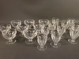 a lot of glasses that are sitting on a table