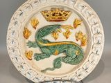 a plate with a dragon and a crown on it